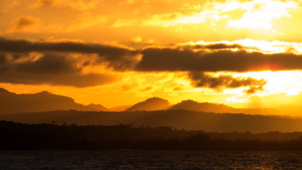 HDR Photo: An orange sunset over a natural part of the Dominican Republic Island near Puerto Plata. The photo was taken from Sosùa.