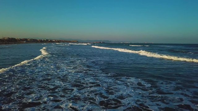 Views from drone during sunset on beach Malvarrosa in Valencia