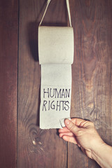 The inscription on the toilet paper "human rights". The concept of non-observance of human rights.