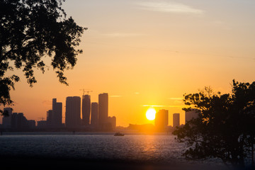 Fototapeta na wymiar Sunset over the city skyline in Miami, FL