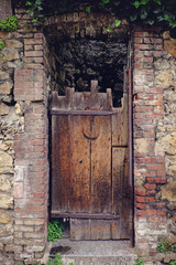 Rustic wooden and brick door.
