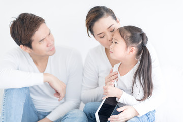Fototapeta premium Parents are asking for forgiveness with unhappy daughter about something. People with relationship difficulties. Conflict family panic attack concept.