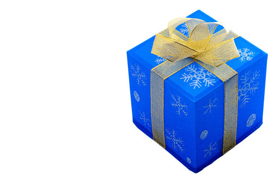 Merry Christmas and Happy holidays concept with a blue gift box with a gold bow, containing a present, isolated on white with a clipping path included