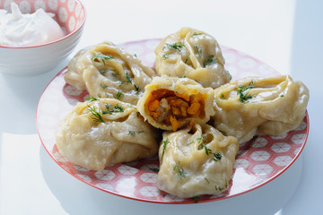 Delicious, mouth-watering dish of South Caucasian, Central Asian cuisine - Manti filled with pumpkin