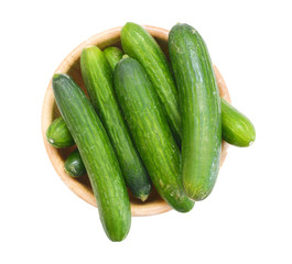 fresh cucumbers in wooden bowl  on white