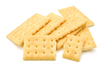 Salty crackers in square shape on white background