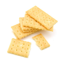 Salty crackers in square shape on white background
