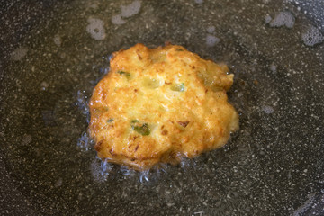 fritters while is frying in the pan