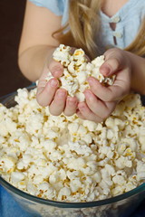 child eating popcorn