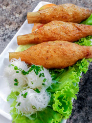 Fried shrimp are crushed and wrapped around sugarcane. with rice noodle. Vietnamese Food