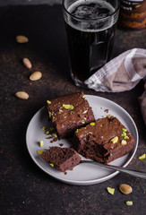 Homemade Brownie on dark beer on stone table. American Classical Dessert Brownie. Use in a recipe of beer. Copy space, top vie