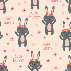 Seamless pattern with cute rabbits and flowers