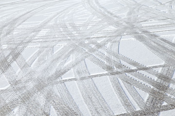 Car tire tracks on snow