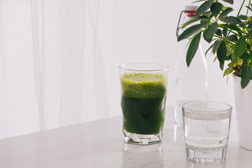 Healthy green smoothie. Natural, organic healthy juice in bottle for weight loss diet