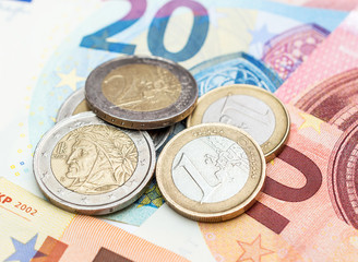 Euro coins on euro bills. Close up. Business concept.