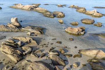 Rocks on the beach with  clear water