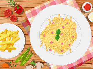 Spaghetti and frenchfries on the table