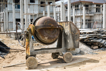 cement concrete mixer machine at new house building construction site