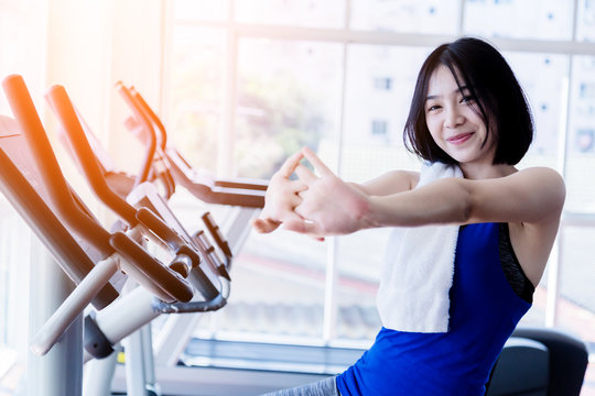 Young Cute Asian Girl Wear Sport Wear Is Relax After Cadio Workout In Fitness Health Club