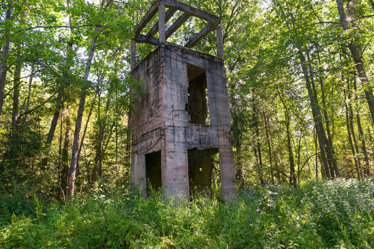 Destroyed by time water tower of reinforced concrete (1914). Manor Zavetnoye. Novgorod Region, Russia