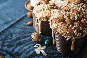 Colomba - italian easter dove cake on old rustic cyan wooden board. Selective focus, free text space.
