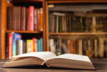Open book on the background of the library
