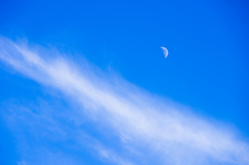Moon and cloud amid the blue sky
