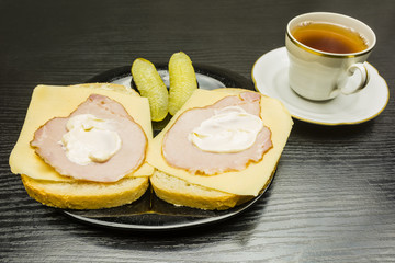 Sandwiches with ham, cheese and mayonnaise.