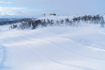 Fototapeta na wymiar View of snowy landscape and ski track in Beitostolen. Winter in Norway
