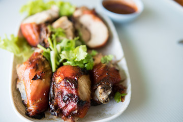 Oven-roasted orange chicken with red onion. Roasted honey chicken legs