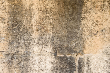 Wall fragment with scratches and cracks