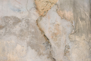 Wall fragment with scratches and cracks