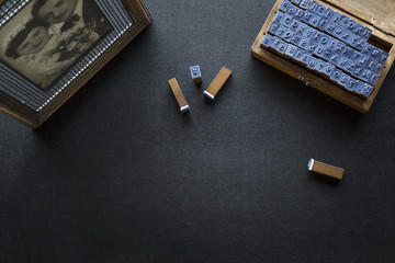 Dark tabletop with letters and a picture