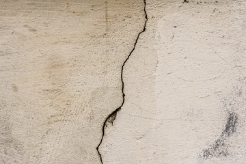 Wall fragment with scratches and cracks