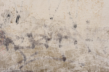 Wall fragment with scratches and cracks