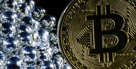 Golden bitcoin on black background with copy space cryptocurrency mining concept  silver; pearl