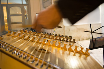 Horizontal View of Close Up of Hands Playing the Salterio Medieval Instrument