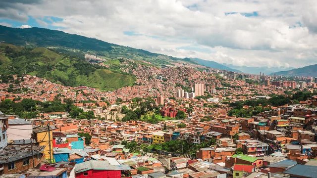 Medellin, Colombia, time lapse view over the famous Comuna 13 slums during daytime. Dolly left to right.