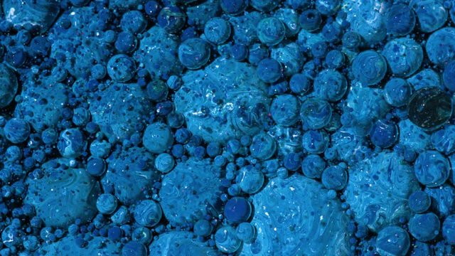 Top view Bright Collors Bubbles Slow Motion Oil Ink is fantastic structure of colorful chaotic motion bubbles stock video is a beautiful, unique, organic 4K clip.
