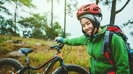  Asian women Travel photograph Nature. Travel relax ride a bike Wilderness in the wild. Thailand