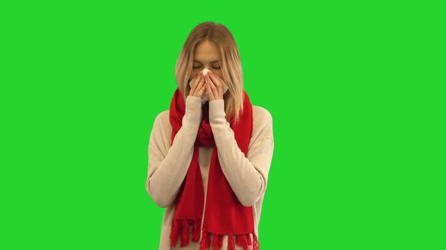 girl and runny nose on a green screen