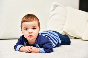 Fototapeta premium Baby boy is lying on tummy