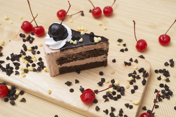 piece of chocolate cake and cherry