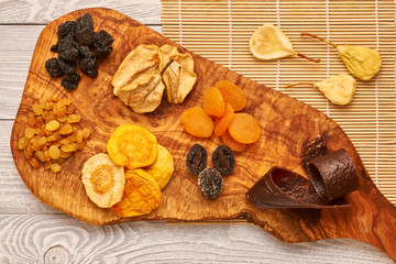 Dried fruits on wooden background