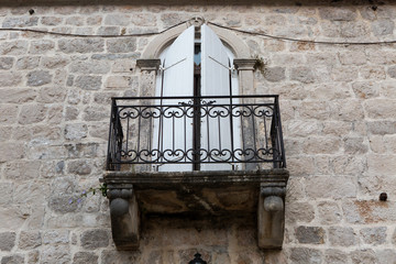 old iron balcony in an old stone house in Montenegro