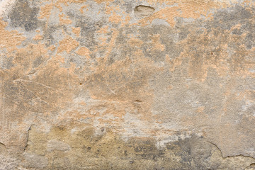 Wall fragment with scratches and cracks