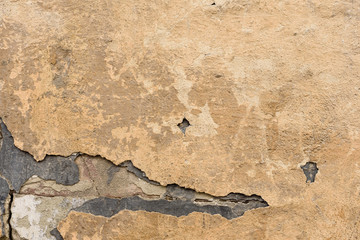 Wall fragment with scratches and cracks