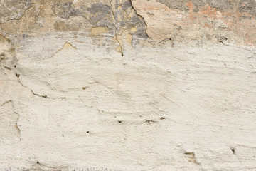 Wall fragment with scratches and cracks