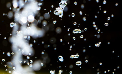 Splashing water from a fountain as an abstract background