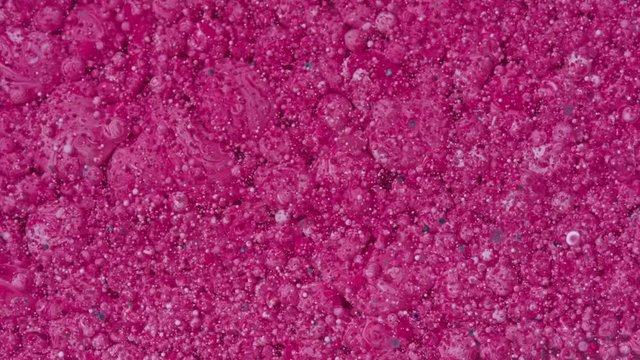 Top view Bright Collors Bubbles Slow Motion Oil Ink is fantastic structure of colorful chaotic motion bubbles stock video is a beautiful, unique, organic 4K clip.